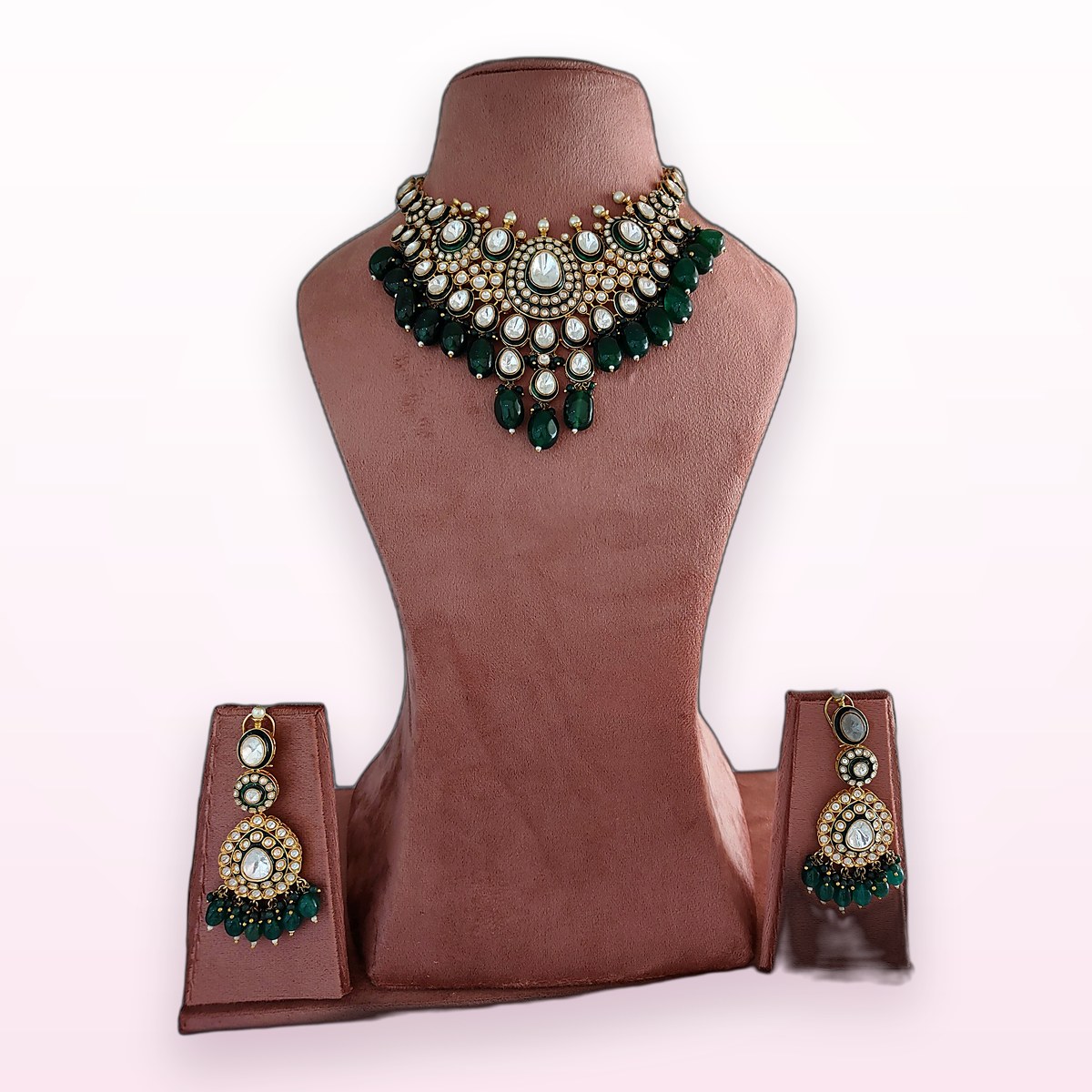 Emerald Kundan Choker on a display bust at KAMYA Makeup Studio & Academy