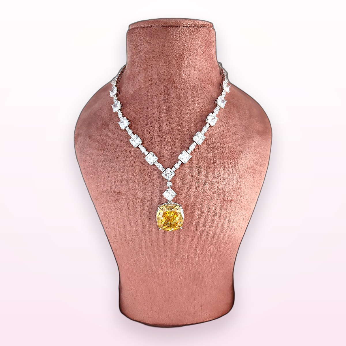 Canary Solitaire Necklace on a display bust at KAMYA Makeup Studio & Academy